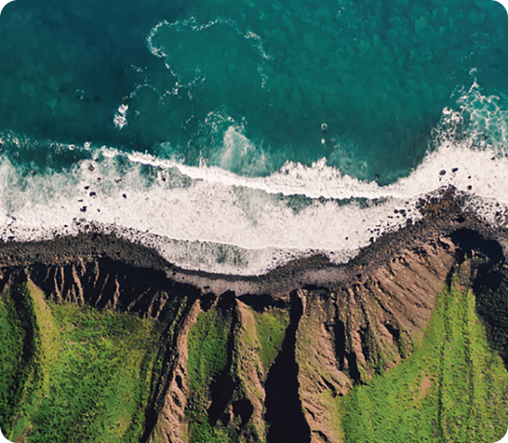 Aerial View of Rugged Coastline and Ocean Waves